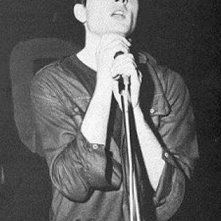 Ian Curtis performing with Joy Division