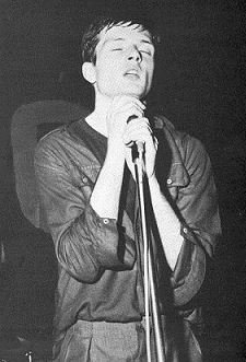 Ian Curtis performing with Joy Division